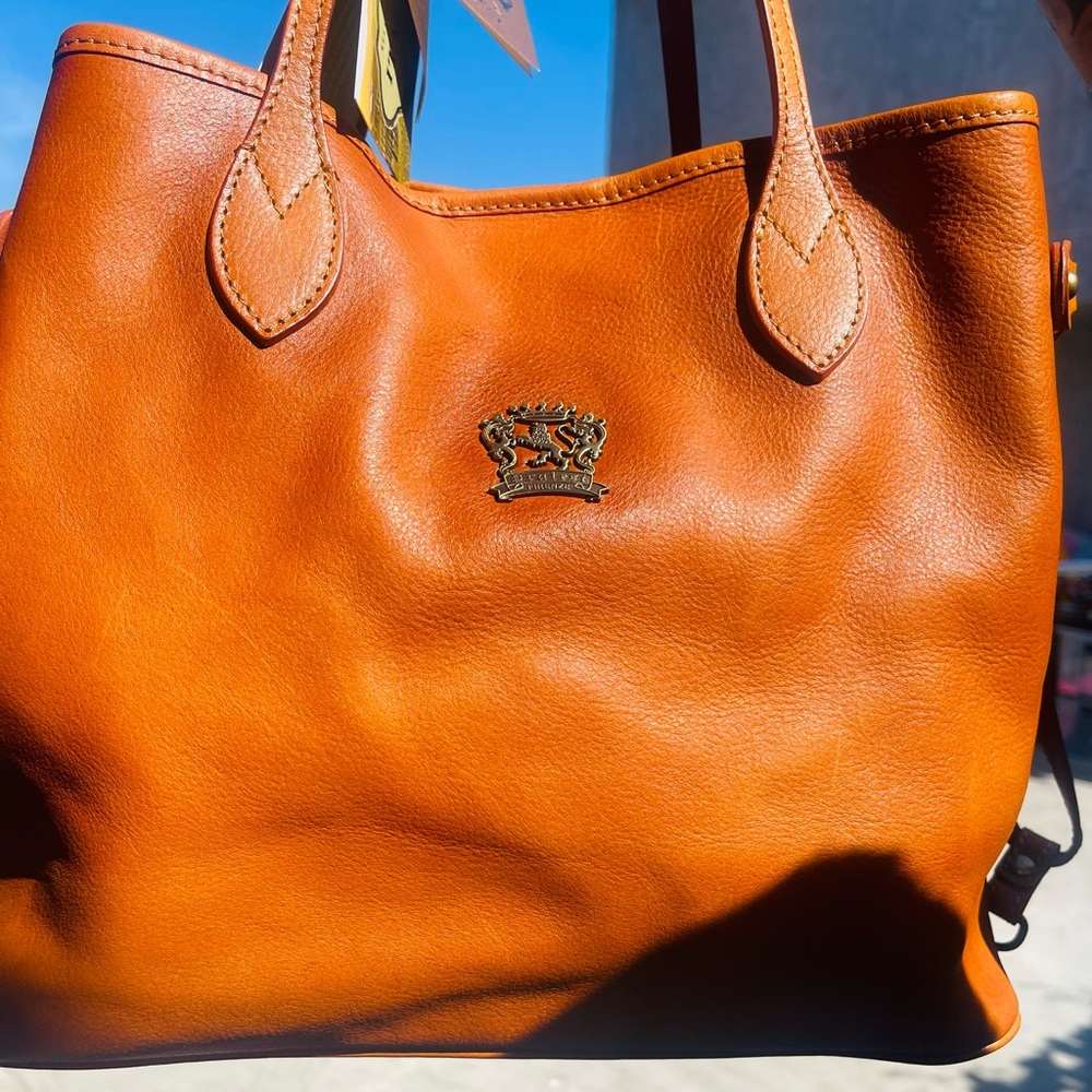New purse Italian leather nice color tho rich color it’s cognac